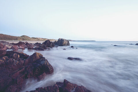 Long exposure of the sea over rocks